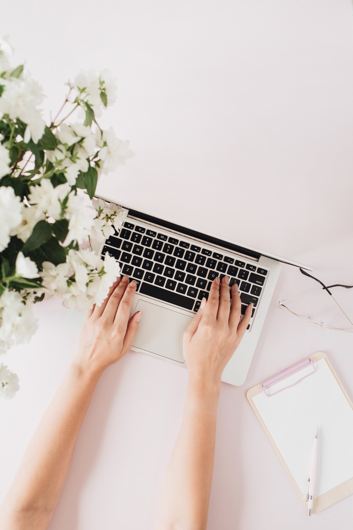 Hands Typing on the Laptop on White Background